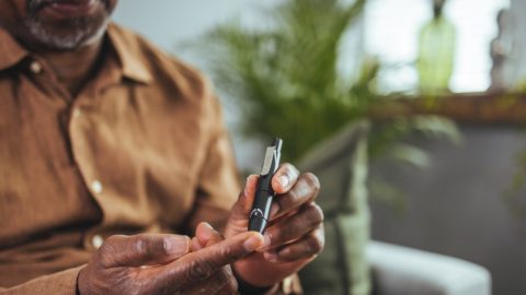 Man checking his blood sugar levels