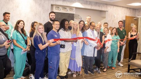 Cutting the ribbon for the new Douglasville office.